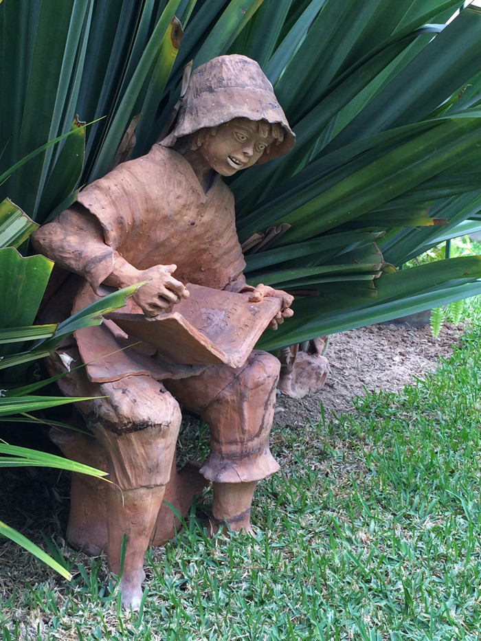 A Really Compelling Book; garden statue, Hotel Señorial, Miraflores, Peru