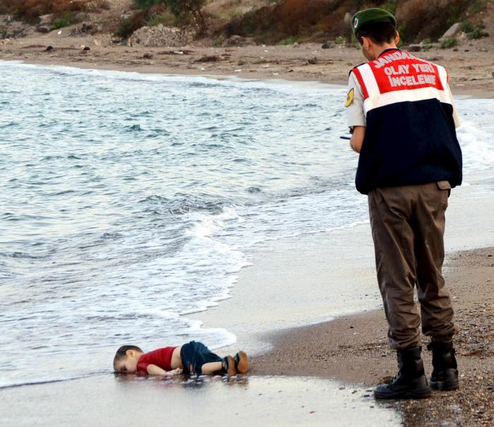 A young Syrian boy lies in the surf near Bodrum, Turkey Reuters